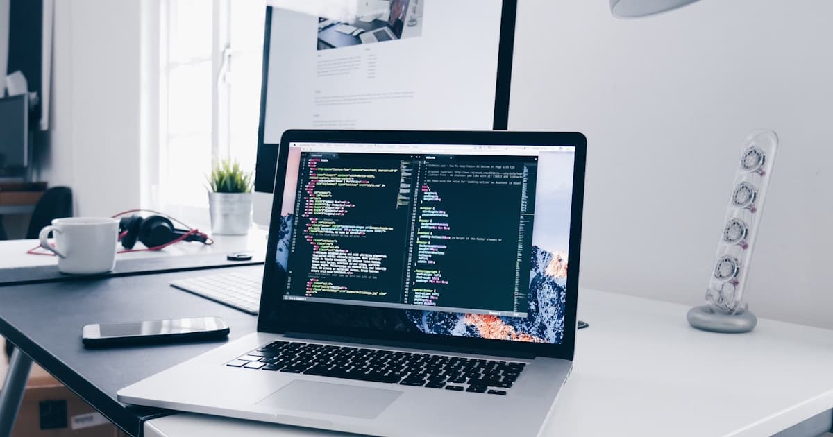 Developer planning and building a business website on a laptop