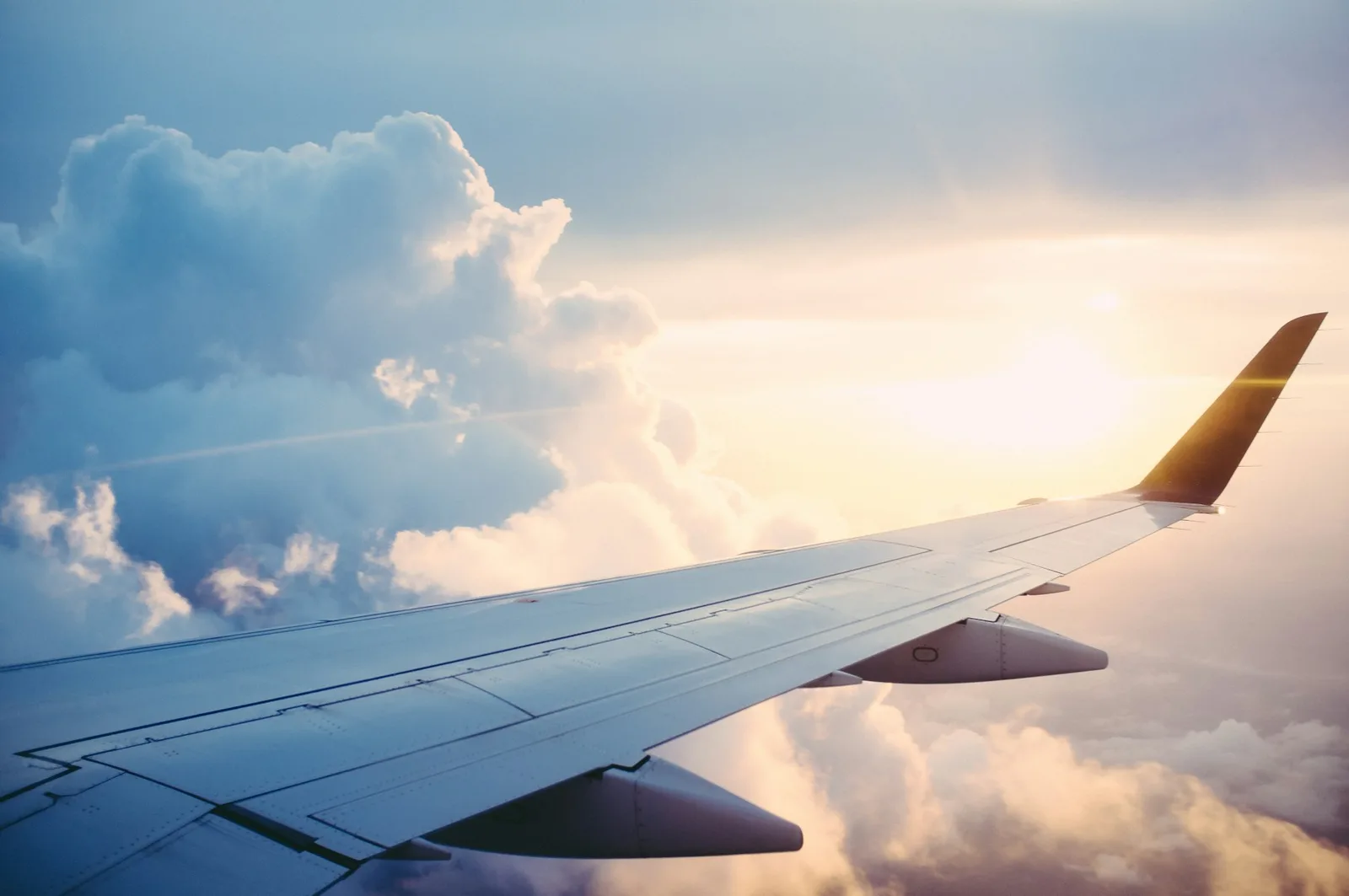 Aircraft wing above the clouds in flight